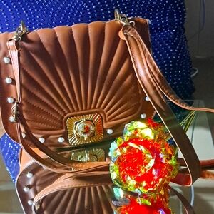 Women's bag or purse. Brown color with gold clasps. Elegant.